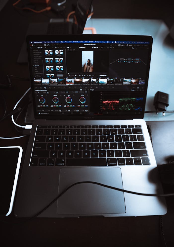 High-angle view of a laptop with video editing software, illustrating a digital editing process.